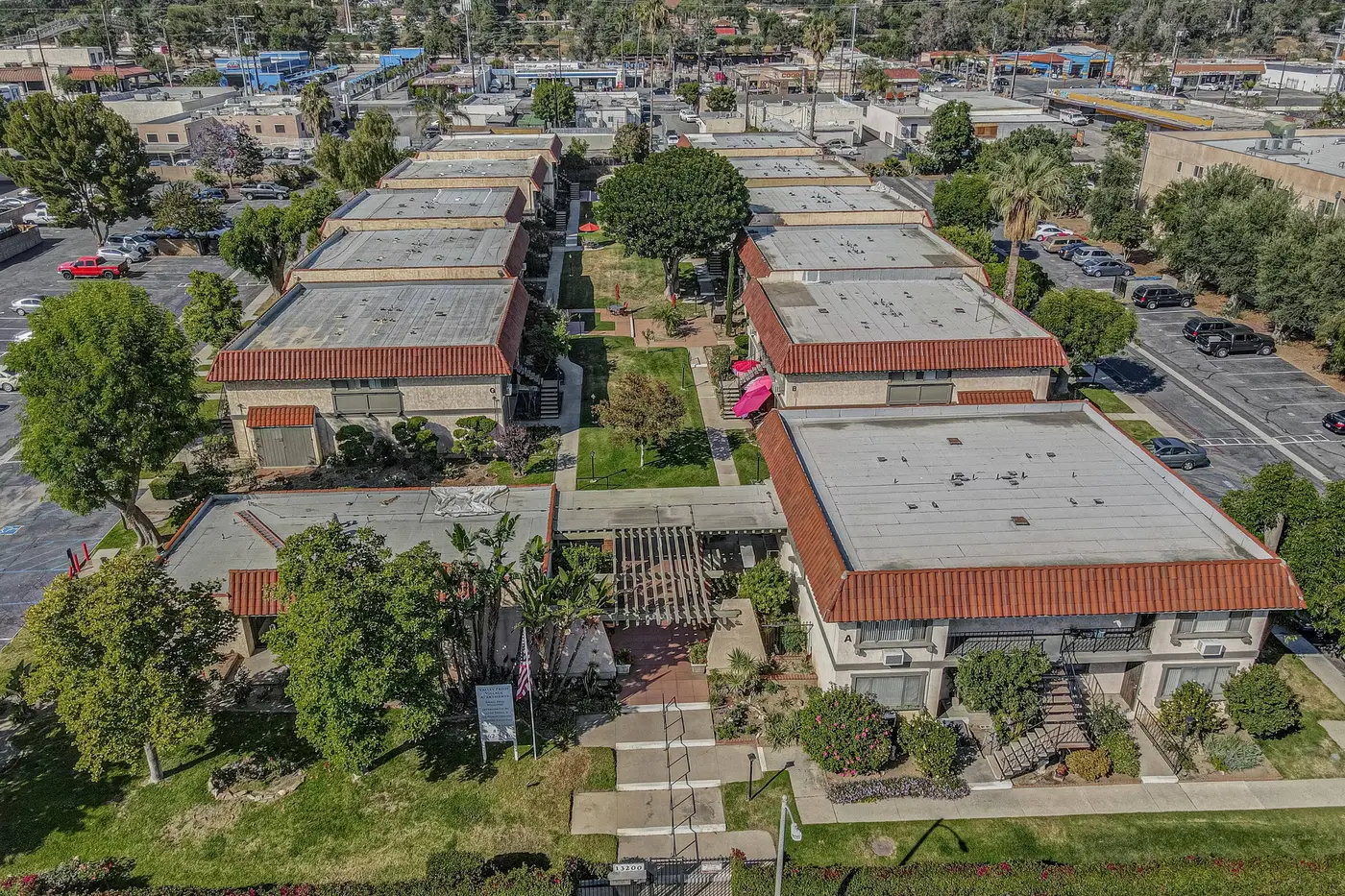 Aerial view of Valley Pride Village, a garden apartment complex at 13200 Bromont Ave in Sylmar