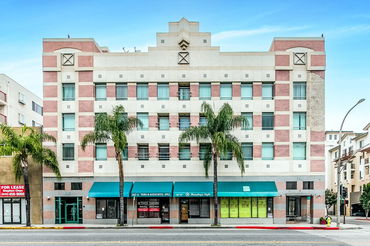 301-317 W Main St, a four-story mixed-use building on Main Street in Alhambra