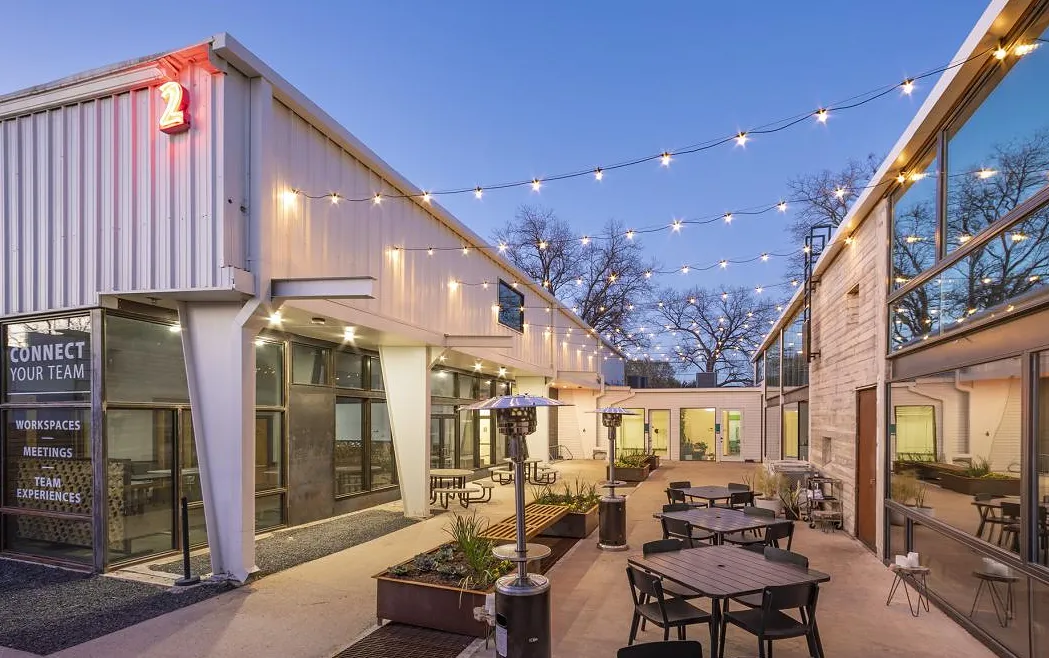 Courtyard of the Holly Commons complex in East Austin at dusk
